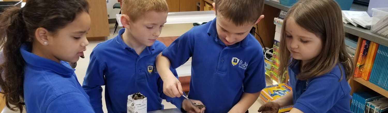 students conduct a hands-on learning science lesson in the top-rated catholic elementary and middle school in mahtomedi