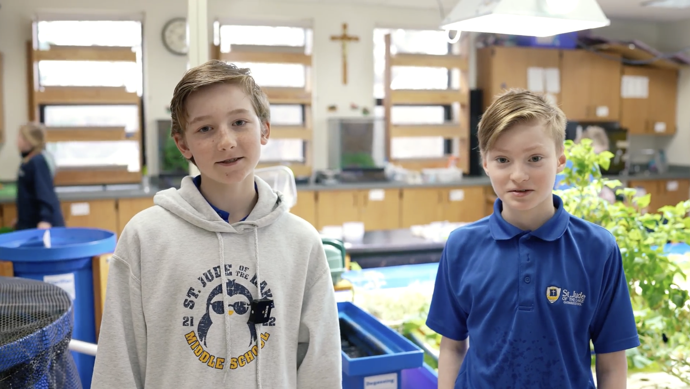 students stand in front of the aquaponics system at a top-rated catholic elementary and middle school in mahtomedi
